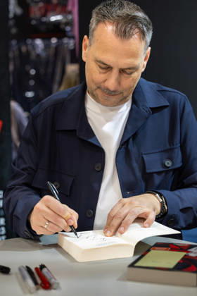 Sebastian Fitzek at the Frankfurt Book Fair, October 9, 2026. German bestselling author and thriller writer Sebastian Fitzek at a book-signing event at the 2026 Frankfurt Book Fair. At the booth of his publisher, Droemer Knau