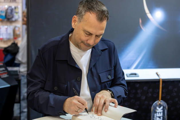 Sebastian Fitzek at the Frankfurt Book Fair, October 9, 2026. German bestselling author and thriller writer Sebastian Fitzek at a book-signing event at the 2026 Frankfurt Book Fair. At the booth of his publisher, Droemer Knau