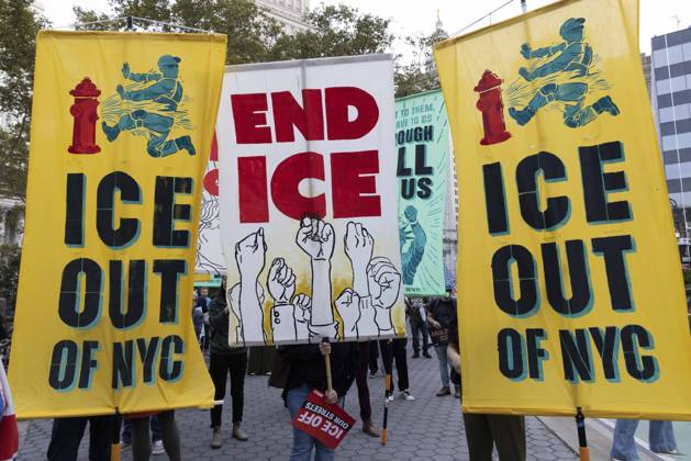 October 9, 2026, New York, New York, USA: Demonstrators march through the streets of Lower Manhattan holding banners that read ICE OUT OF NYC END ICE at the Hands Off NYC coalition emergency protest demanding justice the day following ICE shooting a Bronx man while his 5 year child was in the car. New York USA  - ZUMAr174 20261009_znp_r174_022 Copyright: xGinaxMxRandazzox