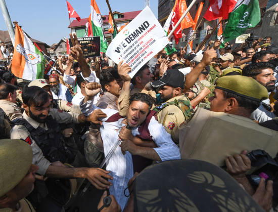 October 10, 2026, Srinagar, Jammu And Kashmir, India: Police personnel try to stop supporters of the opposition alliance INDIA bloc (Indian National Developmental Inclusive Alliance) during a protest demanding the resignation of India s Chief Election Commissioner Gyanesh Kumar over alleged voter roll irregularities linked to the special intensive revision (SIR), in Srinagar on October 10, 2026. Srinagar India  - ZUMAz120 20261010_zip_z120_010 Copyright: xBasitxZargarx
