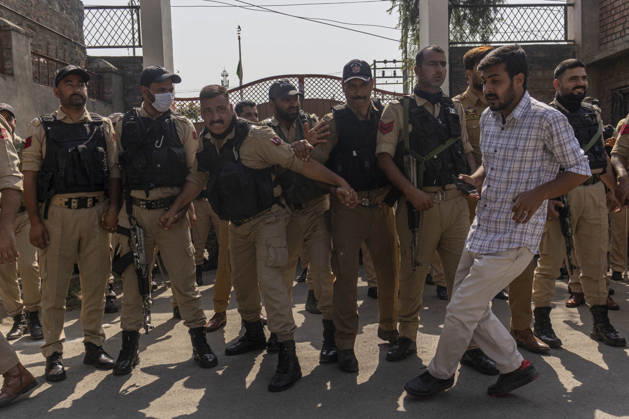 October 10, 2026, Srinagar, Jammu And Kashmir, India: Jammu and Kashmir Police forces personnel stand alert at Congress Bhawan as INDIA bloc alliance partners stage a protest under the Save Democracy Week and Vote Bachao, Desh Bachao campaign, amid row over the resignation of Chief Election Commissioner Gyanesh Kumar in Srinagar, the capital city of Indian Kashmir. Srinagar India  - ZUMAf191 20261010_zip_f191_004 Copyright: xUmarxFarooqx