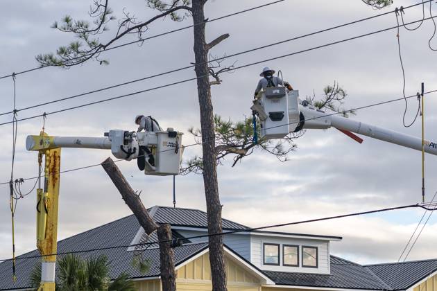 October 10, 2026, Orange Beach, Al, USA: Crews work to repair power lines after a tree fell on them as Hurricane Isaias came ashore..Hurricane Isaias made landfall Friday, October 9 along the U.S. Gulf coast. Orange Beach USA  - ZUMAs197 20261010_aaa_s197_003 Copyright: xJenxGolbeckx