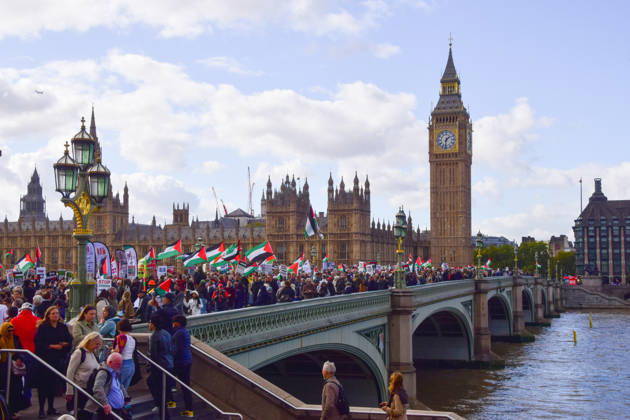 October 10, 2026, London, England, United Kingdom: Protesters pass over Westminster Bridge past the Houses of Parliament as thousands of people march in support of Palestine. The protesters also called on the government to stop arming Israel and for sanctions on Israel. London United Kingdom  - ZUMAv130 20261010_zip_v130_023 Copyright: xVukxValcicx