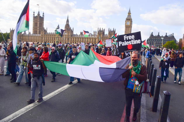 October 10, 2026, London, England, United Kingdom: Protesters pass over Westminster Bridge past the Houses of Parliament as thousands of people march in support of Palestine. The protesters also called on the government to stop arming Israel and for sanctions on Israel. London United Kingdom  - ZUMAv130 20261010_zip_v130_025 Copyright: xVukxValcicx