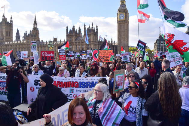 October 10, 2026, London, England, United Kingdom: Protesters pass over Westminster Bridge past the Houses of Parliament as thousands of people march in support of Palestine. The protesters also called on the government to stop arming Israel and for sanctions on Israel. London United Kingdom  - ZUMAv130 20261010_zip_v130_032 Copyright: xVukxValcicx