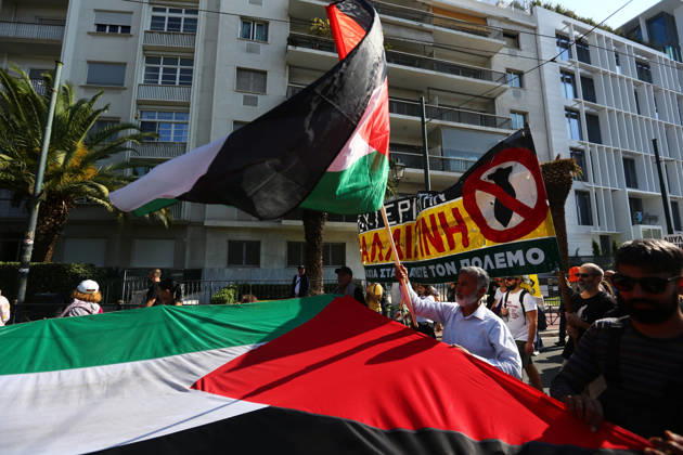 October 10, 2026, Athens, Attica, GREECE: Protesters carry a large Palestinian flag and an anti-war banner during a march in solidarity with Palestine. Athens GREECE  - ZUMAx103 20261010_zip_x103_009 Copyright: xHarrisxXanthopoulosx
