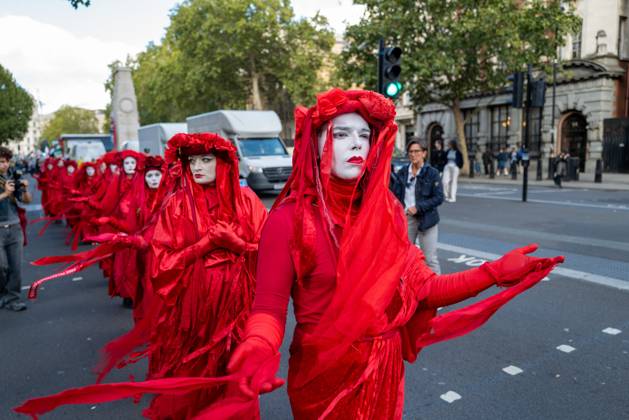 October 10, 2026, London, United Kingdom: Performers from Extinction Rebellion s Red Rebel Brigade stage a silent Walk of Shame procession during the National March for Palestine in London. The National March marks three years since the outbreak of the war in Gaza in October 2023.The National March for Palestine, which was organised by the Palestine Coalition in London. The march marks three years since the outbreak of the war in Gaza in October 2023 London United Kingdom - ZUMAs197 20261010_aaa_s197_058 Copyright: xPhilxLewisx