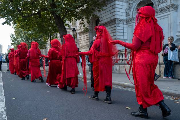 October 10, 2026, London, United Kingdom: Performers from Extinction Rebellion s Red Rebel Brigade stage a silent Walk of Shame procession during the National March for Palestine in London. The National March marks three years since the outbreak of the war in Gaza in October 2023.The National March for Palestine, which was organised by the Palestine Coalition in London. The march marks three years since the outbreak of the war in Gaza in October 2023 London United Kingdom - ZUMAs197 20261010_aaa_s197_059 Copyright: xPhilxLewisx