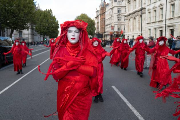October 10, 2026, London, United Kingdom: Performers from Extinction Rebellion s Red Rebel Brigade stage a silent Walk of Shame procession during the National March for Palestine in London. The National March marks three years since the outbreak of the war in Gaza in October 2023.The National March for Palestine, which was organised by the Palestine Coalition in London. The march marks three years since the outbreak of the war in Gaza in October 2023 London United Kingdom - ZUMAs197 20261010_aaa_s197_067 Copyright: xPhilxLewisx