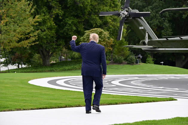 United States President Donald J Trump gestures towards the ballroom construction workers as he departs the South Lawn of the White House in Washington, DC, en route Clarksville, Tennessee on Saturday, October 10, 2026. The President will participate in a campaign rally for Tennessee Republican candidates on the ballot in November.  WAX20261010203 RONxSACHS