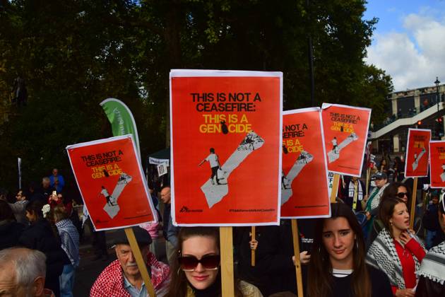 October 10, 2026, London, United Kingdom: Protesters hold This is not a ceasefire, this is genocide placards during the National March for Palestine..Thousands of people marched in Central London marking three years of what the protest organisers call the genocide against the Palestinian people in Gaza London United Kingdom  - ZUMAs197 20261010_aaa_s197_171 Copyright: xVukxValcicx