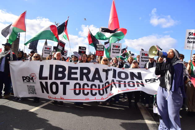 October 10, 2026, London, England, United Kingdom: Protesters pass over Westminster Bridge past the Houses of Parliament during the National March for Palestine. Thousands of people marched in Central London marking three years of what the protest organisers call the genocide against the Palestinian people in Gaza London United Kingdom  - ZUMAv130 20261010_zip_v130_072 Copyright: xVukxValcicx