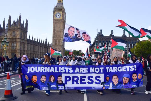 October 10, 2026, London, United Kingdom: Protesters hold a Journalists are not targets banner on Westminster Bridge during the National March for Palestine..Thousands of people marched in Central London marking three years of what the protest organisers call the genocide against the Palestinian people in Gaza London United Kingdom  - ZUMAs197 20261010_aaa_s197_186 Copyright: xVukxValcicx