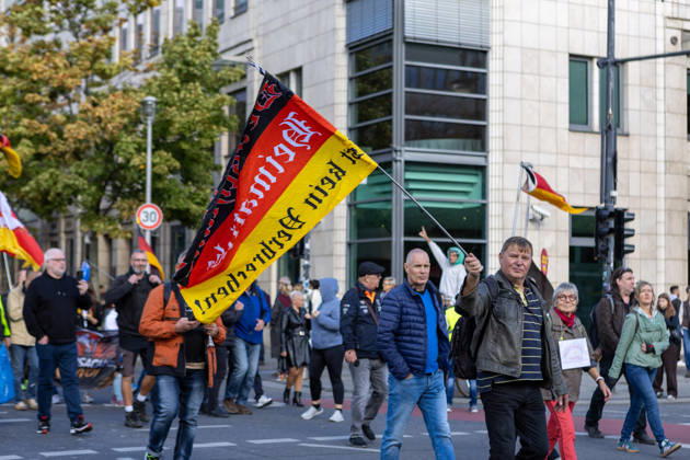 October 10, 2026, Berlin, Berlin, Germany: Demonstrators gather in Berlin for the Project M1llion rally against the German government. Participants take to the streets to voice their opposition to government policies, displaying banners and expressing their political demands. The demonstration brings together people seeking to make their concerns heard and draw public attention to their criticism of the country s political leadership. Berlin Germany  - ZUMAc291 20261010_zip_c291_009 Copyright: xMariaxCastrox