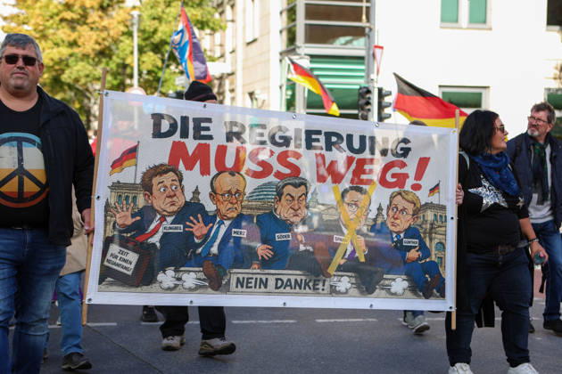 October 10, 2026, Berlin, Berlin, Germany: Demonstrators gather in Berlin for the Project M1llion rally against the German government. Participants take to the streets to voice their opposition to government policies, displaying banners and expressing their political demands. The demonstration brings together people seeking to make their concerns heard and draw public attention to their criticism of the country s political leadership. Berlin Germany  - ZUMAc291 20261010_zip_c291_010 Copyright: xMariaxCastrox
