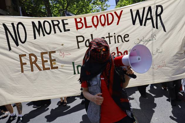 October 11, 2026, Melbourne, Victoria State, Australia: A protester shouts slogans through a megaphone during the rally..Pro-Palestinian demonstrators marched through Melbourne to mark three years since the outbreak of the Gaza war following the Hamas-led attacks on Israel on 7 October 2023 and Israelâ€⠢s subsequent military campaign in Gaza. Protesters called for Palestinian rights and an end to the violence in Gaza. Melbourne Australia - ZUMAs197 20261011_aaa_s197_029 Copyright: xYexMyoxKhantx