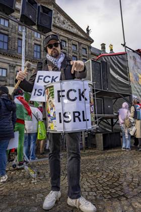 October 11, 2026, Amsterdam, Noord-Holland, The Netherlands: October 11, 2026, Amsterdam, Netherlands: A demonstrator carries a drum displaying the slogan FCK ISRL during a pro-Palestinian protest at Dam Square. The demonstration calls for sanctions against Israel and a permanent ceasefire in Gaza. Amsterdam The Netherlands - ZUMAl165 20261011_zip_l165_014 Copyright: xOrinxLouisx