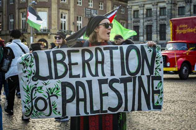 October 11, 2026, Amsterdam, North Holland, The Netherlands - Holland: 11 October 2026, Amsterdam, the Netherlands: Protesters gathered at Dam Square for speeches and anti-war music before marching through AmsterdamÃ¢â‚¬â ¢s city centre in a demonstration dubbed Ã¢â‚¬oeThree Years of GenocideÃ¢â‚¬Â. The event marked three years since the start of the IsraelÃ¢â‚¬Hamas war. Demonstrators carried Palestinian flags and banners, demanding the Dutch government act against what they describe as a genocide in Gaza. Amsterdam The Netherlands - Holland - ZUMAp202 20261011_zip_p202_006 Copyright: xJamesxPetermeierx