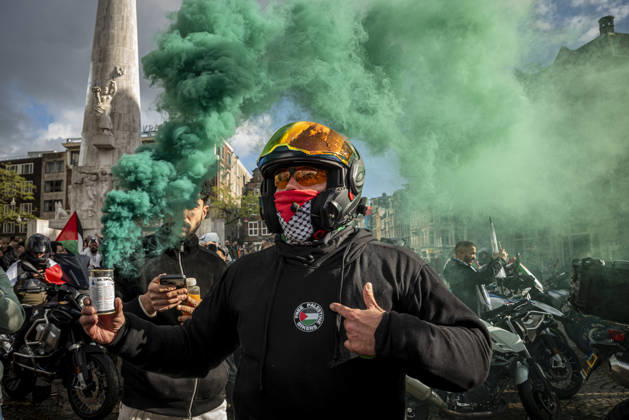 October 11, 2026, Amsterdam, North Holland, The Netherlands - Holland: 11 October 2026, Amsterdam, the Netherlands: Bikers for Palestine members set off smoke flares at Dam Square. Protesters gathered at Dam Square for speeches and anti-war music before marching through AmsterdamÃ¢â‚¬â ¢s city centre in a demonstration dubbed Ã¢â‚¬oeThree Years of GenocideÃ¢â‚¬Â. The event marked three years since the start of the IsraelÃ¢â‚¬Hamas war. Demonstrators carried Palestinian flags and banners, demanding the Dutch government act against what they describe as a genocide in Gaza. Amsterdam The Netherlands - Holland - ZUMAp202 20261011_zip_p202_034 Copyright: xJamesxPetermeierx