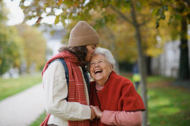 Portrait of a granddaughter on an autumn walk in the park with her grandmother. Portrait of granddaughter on an autumn walk in the park with her grandmother. model released
