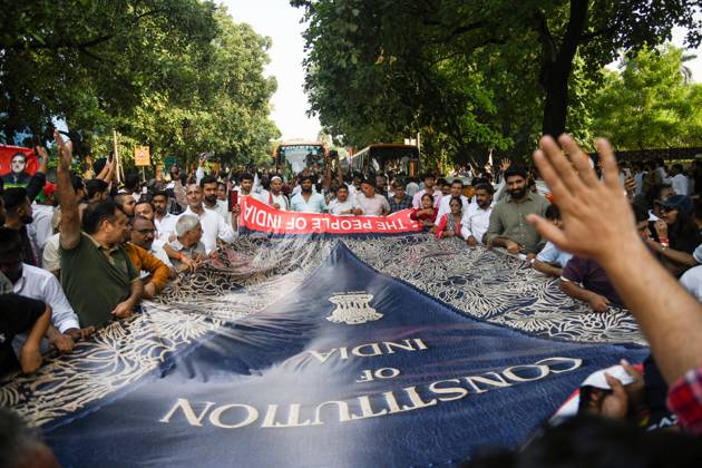 INDIA bloc leaders call for a march towards the Supreme Court New Delhi, Oct 12 (ANI): Supporters carry a large banner with the preamble of the Constitution of India during the INDIA bloc s protest march towards the Supreme Court, in New Delhi on Monday. New Delhi Delhi India Copyright: xANIx ANI_20261012420