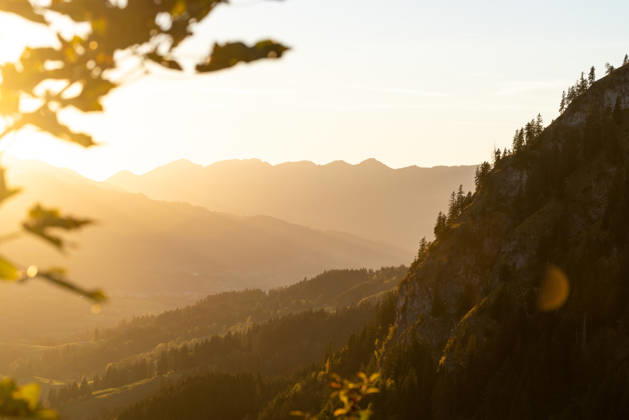 Autumn evening in the Allgäu: A view of the setting sun in the Bavarian Alps near Oberjoch, Bad Hindelang, Bavaria, Germany