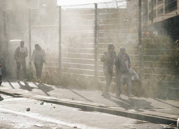 Brussels Belgium Protest People walk past a fenced area amid gas smoke during a protest in Brussels, Belgium on October 12, 2026. Protesters and trade union members stage demonstrations and clash with police during a nationwide public-sector strike against government austerity measures, budget cuts, and reform plans in Brussels, Belgium. Brussels Brussels Capital Belgium Copyright: xSanadxLatifax