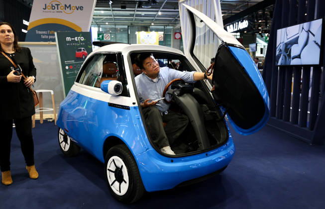 (261012) -- PARIS, Oct. 12, 2026 -- A visitor tries out a vehicle on display at the Paris Motor Show in Paris, France, Oct. 12, 2026. The 2026 Paris Motor Show kicked off here on Monday. ) FRANCE-PARIS-MOTOR SHOW 2026 WuxHuiwo 