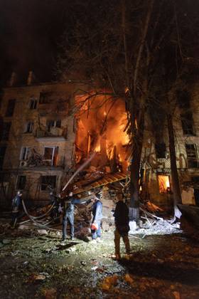 October 12, 2026, Kharkiv, Ukraine: KHARKIV, UKRAINE, OCTOBER 12, 2026: Emergency workers conduct rescue operations at a residential building damaged in a Russian strike in Kharkiv s Kholodnohirskyi district. A firefighter was injured by falling concrete debris while clearing the rubble and was evacuated on a stretcher. Kharkiv Ukraine  - ZUMAq101 20261012_zna_q101_144 Copyright: xAndrewxClingx