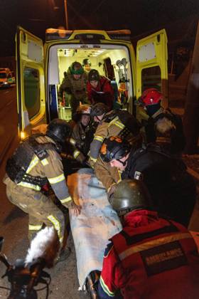 October 12, 2026, Kharkiv, Ukraine: KHARKIV, UKRAINE, OCTOBER 12, 2026: Emergency workers conduct rescue operations at a residential building damaged in a Russian strike in Kharkiv s Kholodnohirskyi district. A firefighter was injured by falling concrete debris while clearing the rubble and was evacuated on a stretcher. Kharkiv Ukraine - ZUMAq101 20261012_zna_q101_140 Copyright: xAndrewxClingx