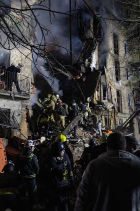 October 12, 2026, Kharkiv, Ukraine: KHARKIV, UKRAINE, OCTOBER 12, 2026: Emergency workers conduct rescue operations at a residential building damaged in a Russian strike in Kharkiv s Kholodnohirskyi district. A firefighter was injured by falling concrete debris while clearing the rubble and was evacuated on a stretcher. Kharkiv Ukraine - ZUMAq101 20261012_zna_q101_143 Copyright: xAndrewxClingx