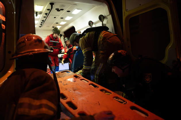 October 12, 2026, Kharkiv, Kharkiv Oblast, Ukraine: Rescuers load an injured firefighter into an ambulance after a sustained injury clearing debris at a Russian cruise missile strike on a residential area in Kharkiv, Ukraine, 2026. Kharkiv Ukraine - ZUMAm350 20261012_zip_m350_003 Copyright: xCameronxJones-Manleyx