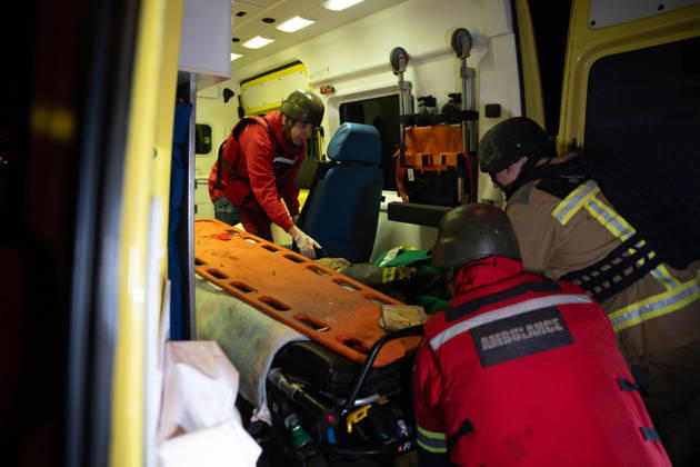 October 12, 2026, Kharkiv, Kharkiv Oblast, Ukraine: Rescuers load an injured firefighter into an ambulance after a sustained injury clearing debris at a Russian cruise missile strike on a residential area in Kharkiv, Ukraine, 2026. Kharkiv Ukraine - ZUMAm350 20261012_zip_m350_004 Copyright: xCameronxJones-Manleyx