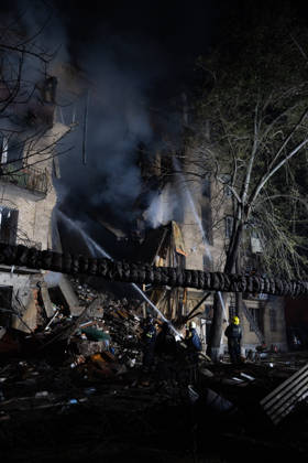 October 12, 2026, Kharkiv, Kharkiv Oblast, Ukraine: Local rescue workers and volunteers clear rubble following a Russian Missile attack on a residential area that killed multiple people in Kharkiv, Ukraine. Emergency crews search through the heavily damaged building and collapsed sections of the building for survivors and the remains of those killed in the attack. Kharkiv Ukraine  - ZUMAm350 20261012_zip_m350_008 Copyright: xCameronxJones-Manleyx