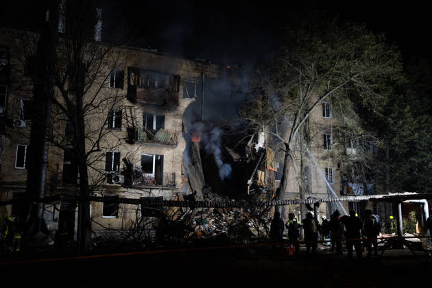 October 12, 2026, Kharkiv, Kharkiv Oblast, Ukraine: Local rescue workers and volunteers clear rubble following a Russian Missile attack on a residential area that killed multiple people in Kharkiv, Ukraine. Emergency crews search through the heavily damaged building and collapsed sections of the building for survivors and the remains of those killed in the attack. Kharkiv Ukraine - ZUMAm350 20261012_zip_m350_009 Copyright: xCameronxJones-Manleyx