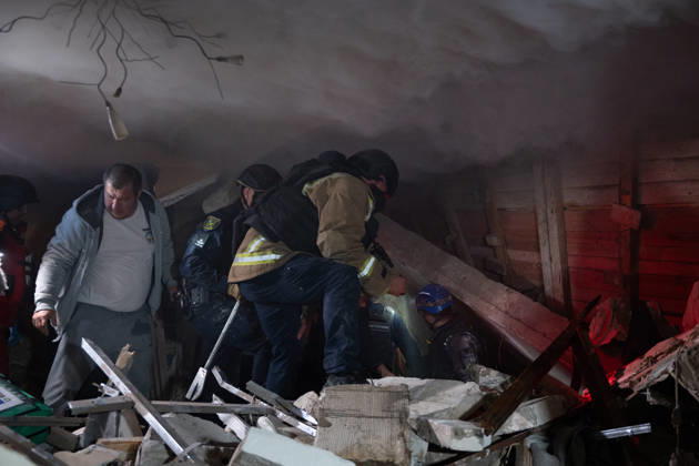 October 12, 2026, Kharkiv, Kharkiv Oblast, Ukraine: Local rescue workers and volunteers clear rubble following a Russian Missile attack on a residential area that killed multiple people in Kharkiv, Ukraine. Emergency crews search through the heavily damaged building and collapsed sections of the building for survivors and the remains of those killed in the attack. Kharkiv Ukraine  - ZUMAm350 20261012_zip_m350_017 Copyright: xCameronxJones-Manleyx
