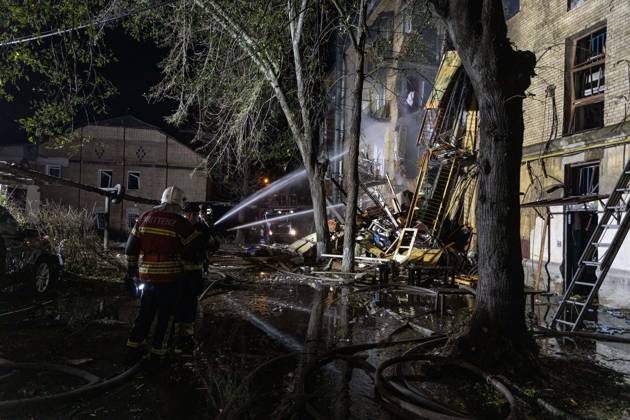 October 13, 2026, Kharkiv, Ukraine: KHARKIV, UKRAINE, OCTOBER 12, 2026: A Russian strike destroyed a section of a four-story residential building in the Kholodnohirskyi District of Kharkiv, Ukraine, on the evening of October 12. Authorities said Russian forces used Banderol-type missiles in the attack. Rescuers recovered the bodies of three people, and search operations continued. Kharkiv Ukraine - ZUMAq101 20261013_zna_q101_037 Copyright: xAndrewxClingx