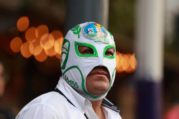 Thousands of healthcare workers hold national protest in Mexico City MEXICO CITY, MEXICO - OCTOBER 13: A masked man takes part in a national protest march demanding wage increases for healthcare workers and more medical supplies for Mexico s public health system, in Mexico City, Mexico on October 13, 2026. Thousands of members of the Mexican Social Security Institute (IMSS) marched to demand higher wages, improved working conditions, and action to address nationwide shortages of basic medicines and supplies across public hospitals. Daniel Cardenas Anadolu Mexico City Mexico. Editorial use only. Please get in touch for any other usage.  Copyright: x2026xAnadoluxDanielxCardenasx