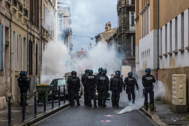 High School Stdent Mobilisation - Bordeaux Police officers in riot gear stand in a street filled with smoke during Act V of the high school student mobilisation in Bordeaux, France on October 13, 2026. Photo by Fabrice Sapte ABACAPRESS.COM Bordeaux France  Copyright: xSaptexFabrice ABACAx