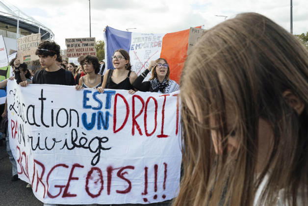 High School Student Mobilisation - Toulouse A blue, white and red flag bearing the slogan - La jeunesse emmerde le RN - in the midst of schoolgirls standing behind a banner. Act V of the secondary school and university students protests. Young people and the world of work are continuing their joint mobilisation and demands for adequate resources for education, better study conditions, an end to student precariousness, and access to housing. France, Toulouse, 13 October 2026. Photo by Patricia Huchot-Boissier AbacaPress.com. TOULOUSE OCCITANIE France  Copyright: xHuchot-BoissierxPatricia ABACAx