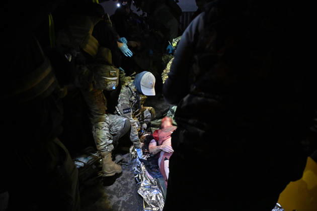 Ballistic missile strikes next to nine-story residential building in Desnianskyi district of Kyiv CAUTION, SENSITIVE CONTENT. A volunteer with the medical volunteer unit Crew13 stands near the body of a person killed in a Russian missile strike on a nine-story residential building in Kyiv’s Desnianskyi district, Ukraine, on October 14, 2026. Russia launched a massive ballistic missile attack on the capital. Three women were killed and 19 people were injured in the Desnianskyi district, including a seven-year-old girl. Apartments on the first through eighth floors of the building were also damaged, Credit:Oleksandr Klymenko Ukrinform Avalon Ukraine, Kyiv  Copyright: xOleksandrxKlymenkox xUkrinformx xAvalonx 1143212101