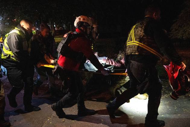 3 Dead and 19 Injured as Russian Missile Hits Residential Building - Kyiv Rescuers carry an injured person on a stretcher after a Russian missile strike on a nine-story residential building in the Desnianskyi district of Kyiv, Ukraine, on October 14, 2026. Russia launched a massive ballistic missile attack on the capital. Three women were killed and 19 people were injured in the Desnianskyi district, including a seven-year-old girl. Apartments on the first through eighth floors of the building were also damaged Photo by Danylo Antoniuk Ukrinform ABACAPRESS.COM Kyiv Ukraine  Copyright: xUkrinform ABACAx