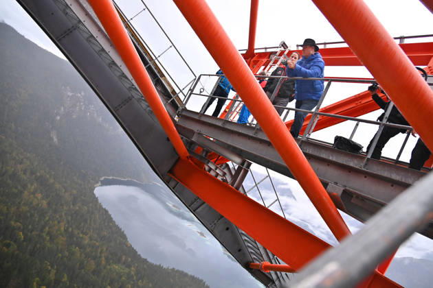 Markus SOEDER, Minister-President of Bavaria and CSU Chairman, steps out of the Zugspitzbahn gondola halfway up the mountain, stands on one of the cable car’s support towers at a dizzying height, and looks o
