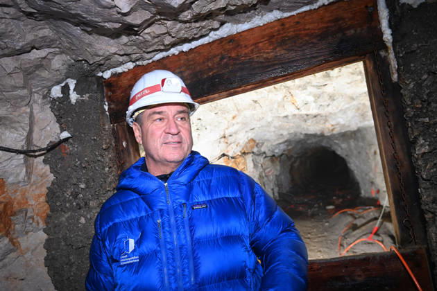Markus SOEDER, Minister-President of Bavaria and CSU Chairman, stands in front of the entrance to a tunnel, examining the permafrost inside,which is melting year after year as a result of climate change. Minister-Preside