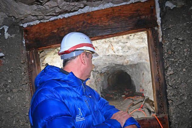 Markus SOEDER, Minister-President of Bavaria and CSU Chairman, stands in front of the entrance to a tunnel, examining the permafrost inside,which is melting year after year as a result of climate change. Minister-Preside