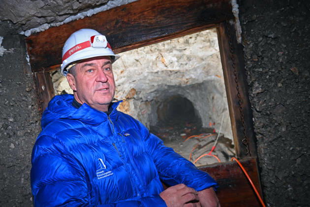 Markus SOEDER, Minister-President of Bavaria and CSU Chairman, stands in front of the entrance to a tunnel, examining the permafrost inside,which is melting year after year as a result of climate change. Minister-Preside