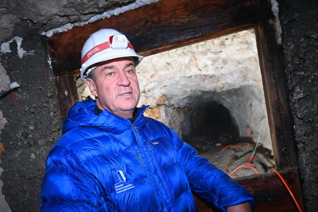 Markus SOEDER, Minister-President of Bavaria and CSU Chairman, stands in front of the entrance to a tunnel, examining the permafrost inside,which is melting year after year as a result of climate change. Minister-Preside