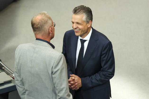 Matthias Miersch and Thorsten Frei at the session of the German Bundestag on October 14, 2026, in Berlin; Chancellor Merz delivering the government statement to the German Bundestag