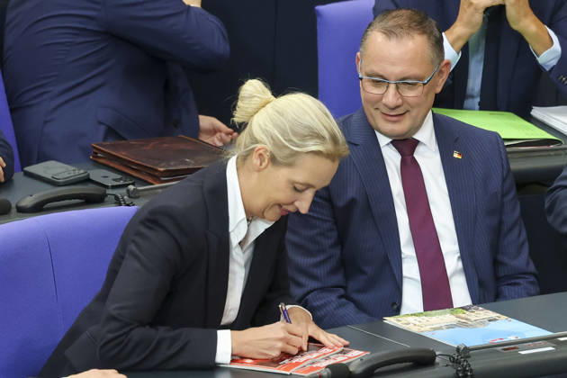 Alice Weidel and Tino Chrupalla at the session of the German Bundestag on October 14, 2026, in Berlin; Chancellor Merz delivering the government statement in the German Bundestag