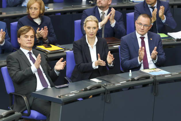 Bernd Baumann, Alice Weidel, and Tino Chrupalla at the session of the German Bundestag on October 14, 2026, in Berlin; Chancellor Merz delivering the government’s policy statement to the German Bundestag
